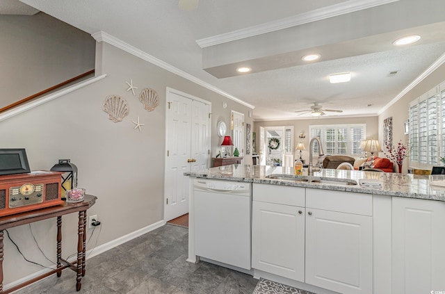 kitchen with light stone countertops, white cabinets, ceiling fan, sink, and dishwasher