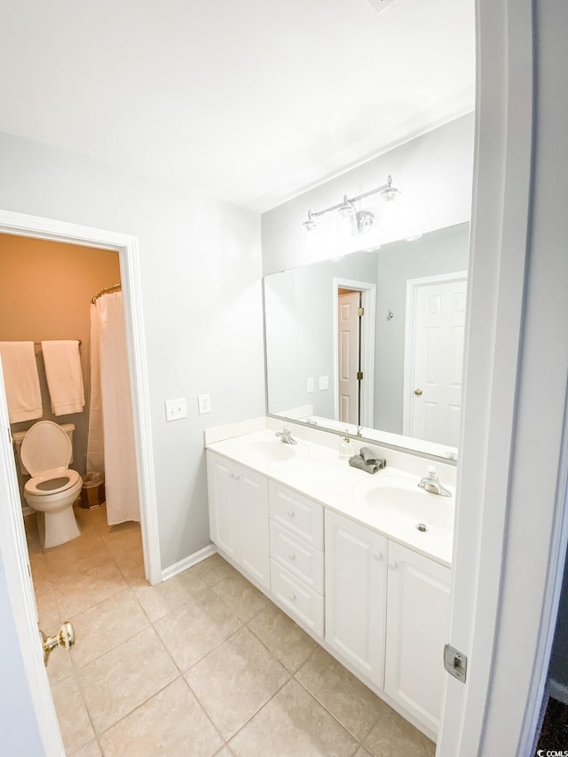 bathroom with tile patterned flooring and vanity