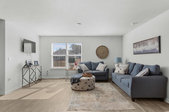 living room with light hardwood / wood-style flooring