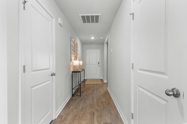 hall with light wood-type flooring