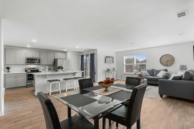 dining area with light hardwood / wood-style flooring