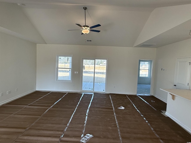 unfurnished living room featuring visible vents, lofted ceiling, and a ceiling fan