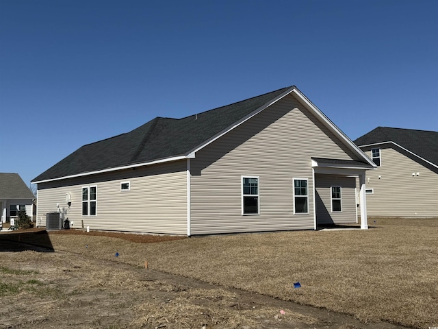 back of house featuring cooling unit