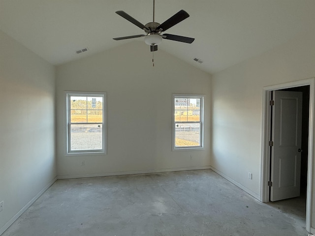 unfurnished room with visible vents, concrete flooring, ceiling fan, and vaulted ceiling