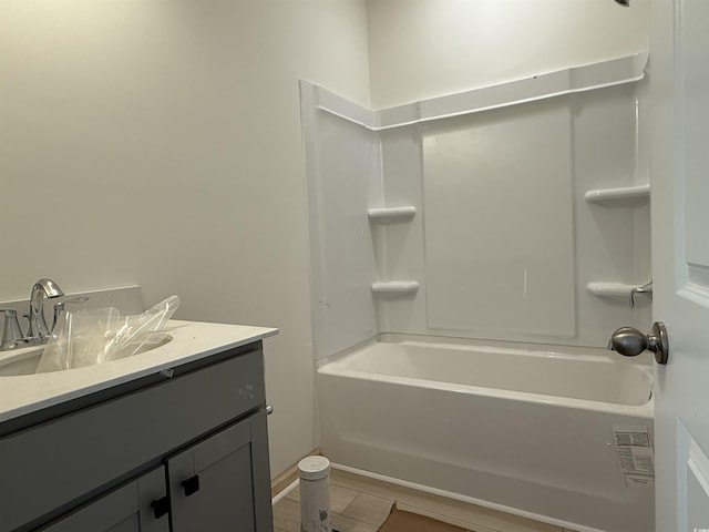 full bath featuring vanity and bathtub / shower combination