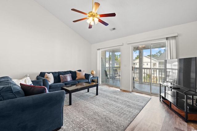 living room featuring ceiling fan, hardwood / wood-style floors, and high vaulted ceiling