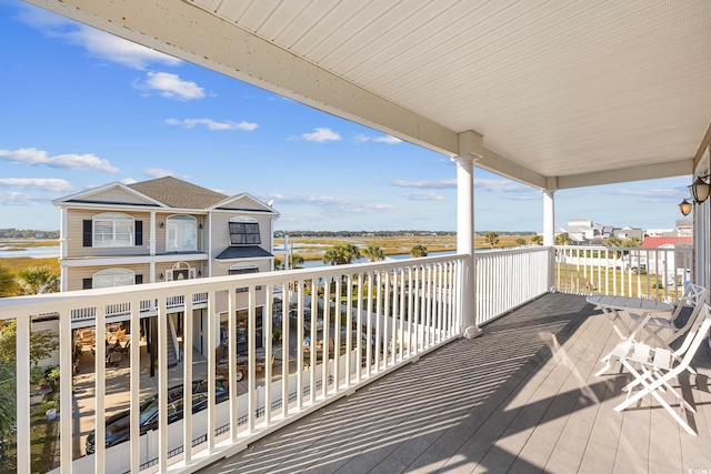 wooden terrace with a water view