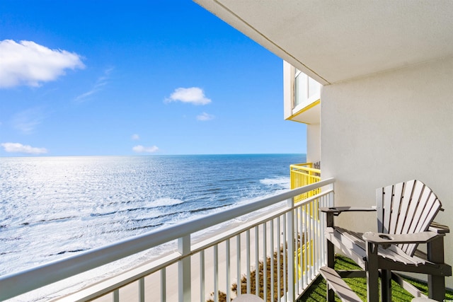 balcony with a view of the beach and a water view