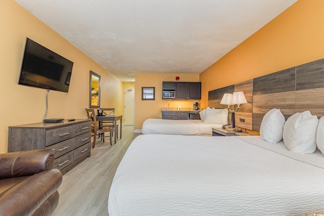 bedroom with light hardwood / wood-style flooring