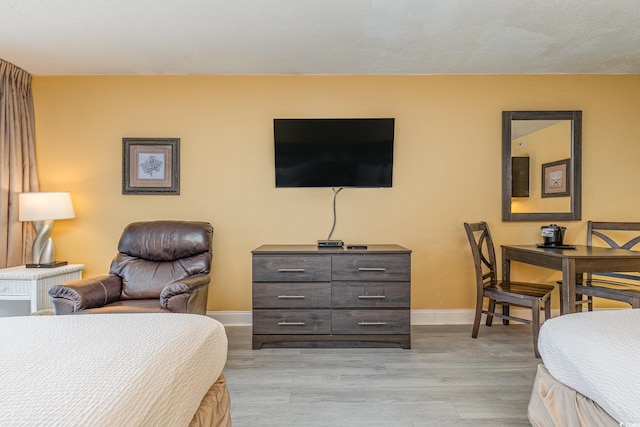 bedroom with light hardwood / wood-style flooring