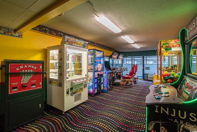 recreation room with a textured ceiling and carpet floors