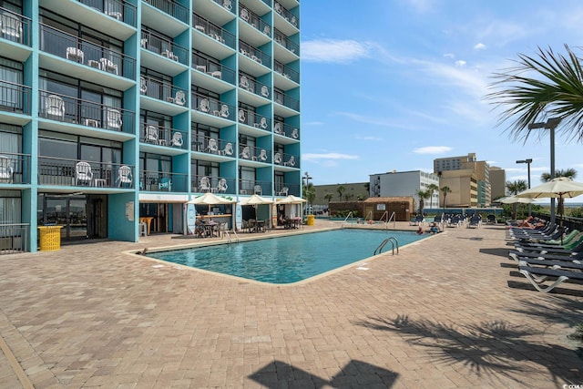 view of pool featuring a patio area