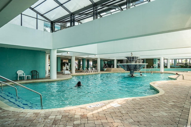 view of swimming pool with pool water feature