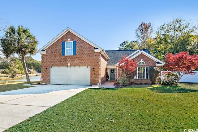 traditional home featuring a front yard, brick siding, driveway, and an attached garage