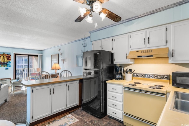 kitchen featuring black appliances, white cabinets, crown molding, dark tile patterned floors, and a textured ceiling