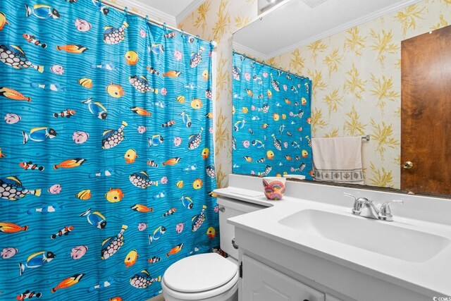 bathroom featuring vanity, toilet, and ornamental molding