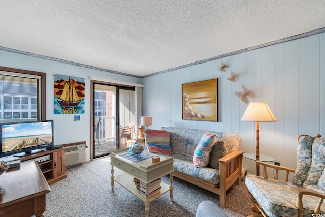 living room featuring carpet flooring, a textured ceiling, a wall mounted air conditioner, and wood walls