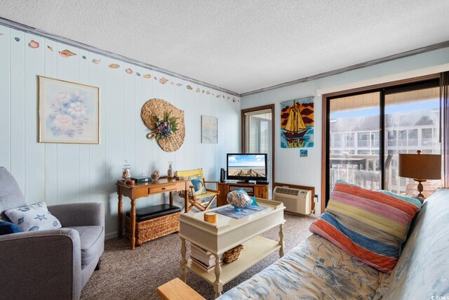 living room with an AC wall unit, wood walls, carpet, and a textured ceiling