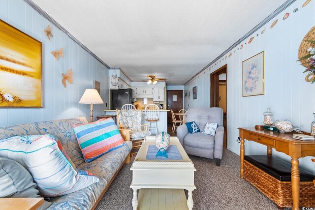 carpeted living room featuring crown molding