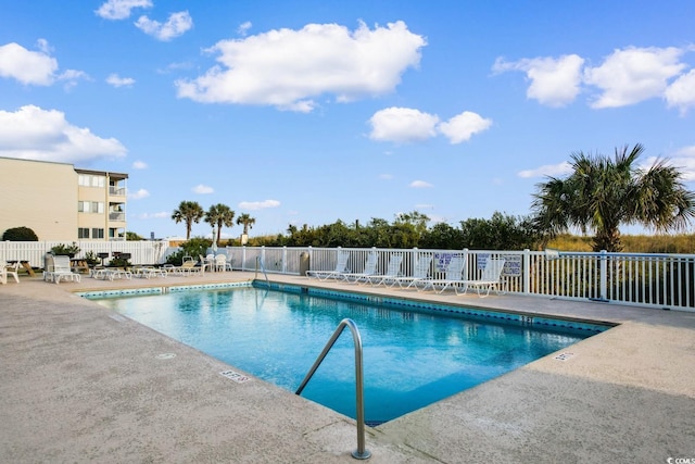 view of swimming pool featuring a patio