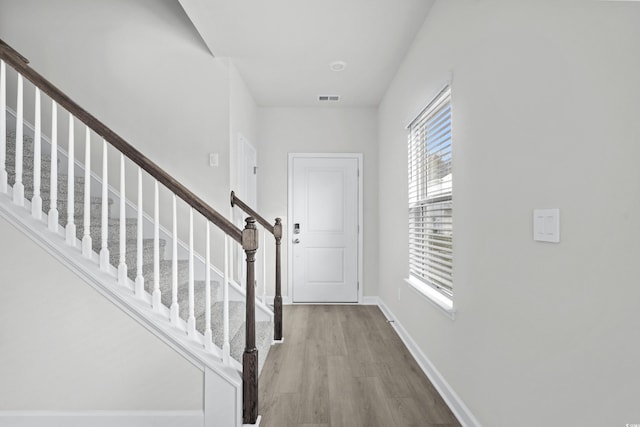 foyer entrance with light wood-type flooring