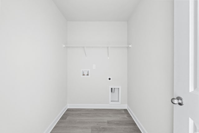 laundry room featuring washer hookup, hardwood / wood-style flooring, and hookup for an electric dryer