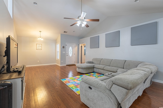 living room featuring baseboards, visible vents, hardwood / wood-style flooring, ceiling fan, and high vaulted ceiling