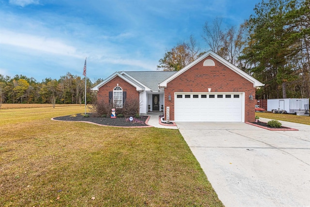 view of front of house with concrete driveway, brick siding, a front lawn, and an attached garage