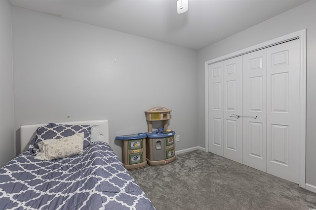 bedroom with a closet, carpet flooring, and baseboards