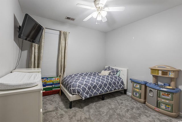 bedroom with carpet, visible vents, and a ceiling fan