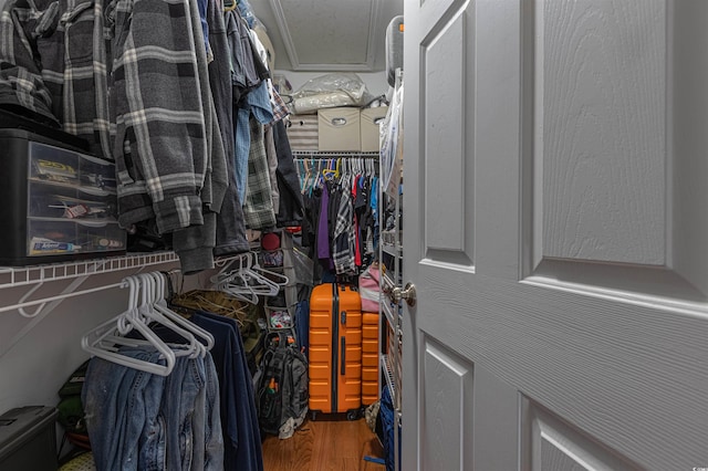 walk in closet featuring wood finished floors