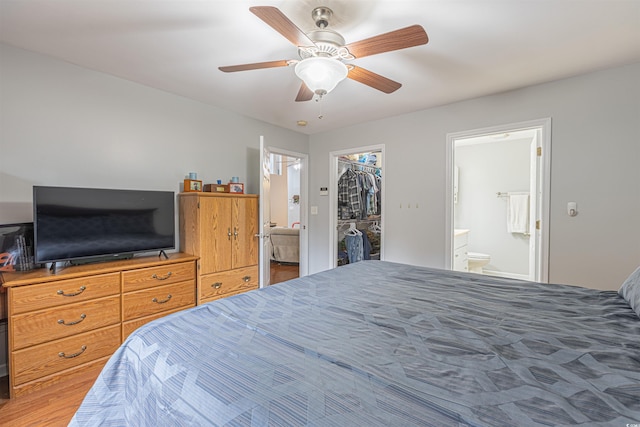 bedroom featuring a closet, ceiling fan, a spacious closet, and ensuite bathroom