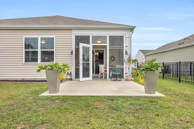 back of house featuring a yard and a patio