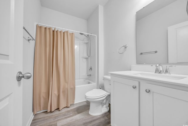 full bathroom with vanity, hardwood / wood-style floors, shower / bathtub combination with curtain, and toilet