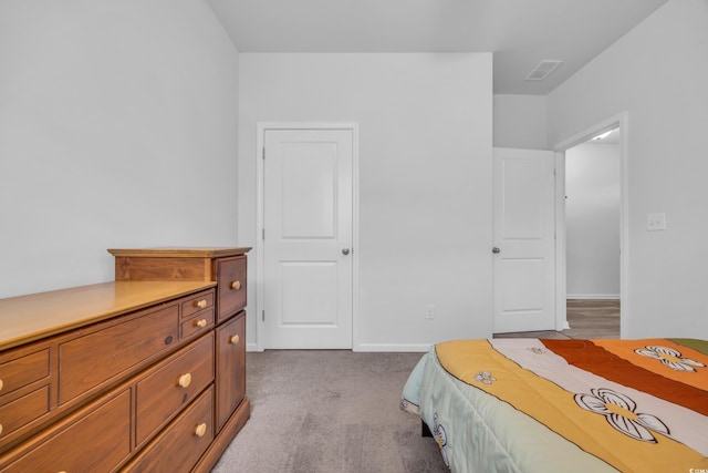 bedroom with light colored carpet