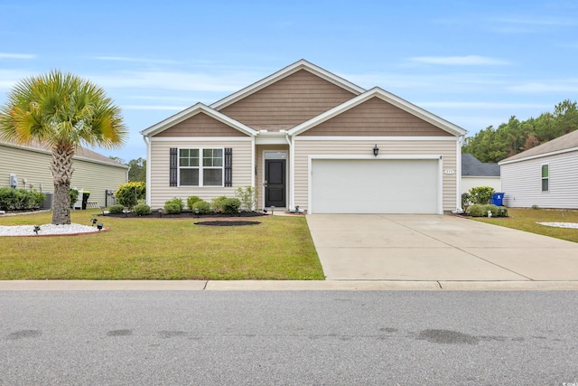 view of front facade featuring a front yard and a garage