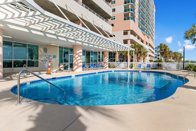 view of pool featuring a patio area