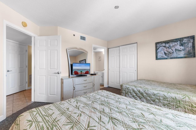 carpeted bedroom featuring a closet