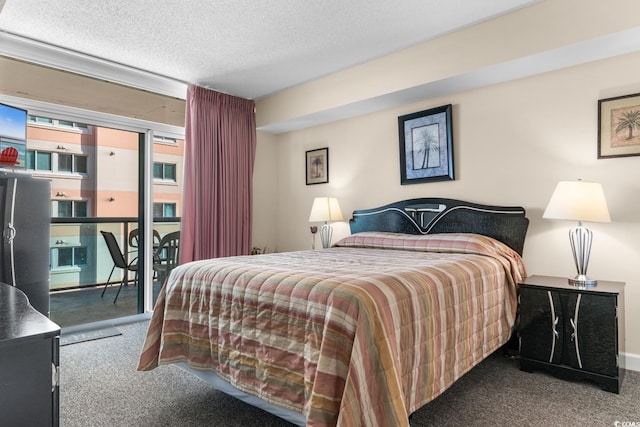 carpeted bedroom featuring access to exterior and a textured ceiling