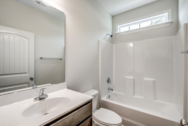 full bathroom featuring vanity, shower / washtub combination, and toilet