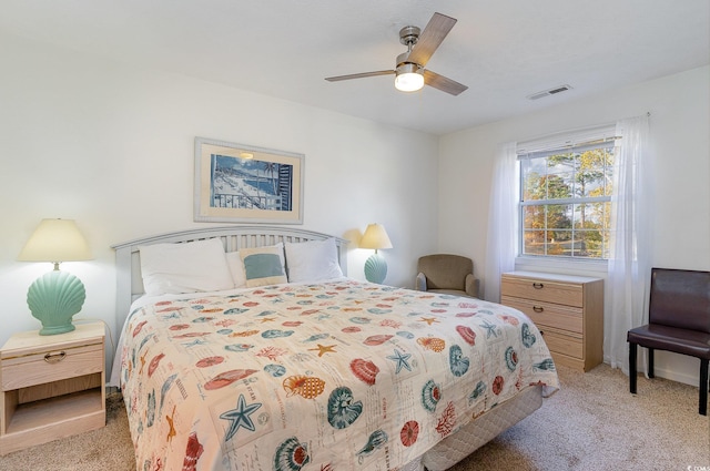 bedroom with ceiling fan and light colored carpet