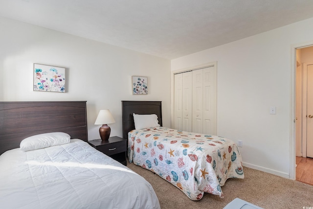 carpeted bedroom featuring a closet