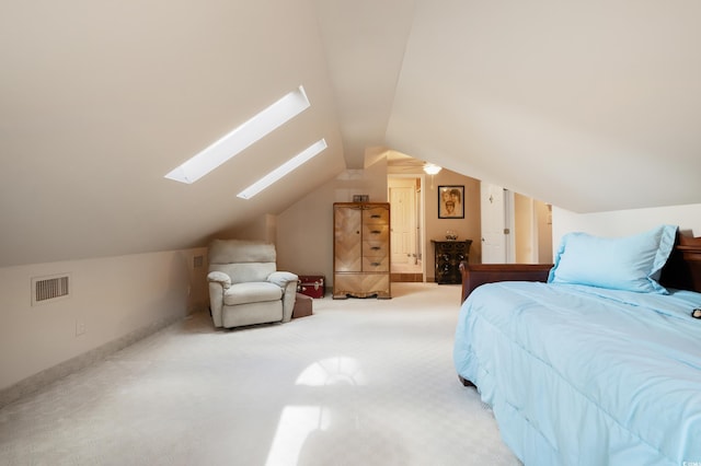 carpeted bedroom with lofted ceiling with skylight