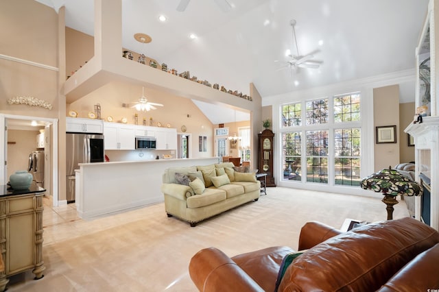 carpeted living room with high vaulted ceiling