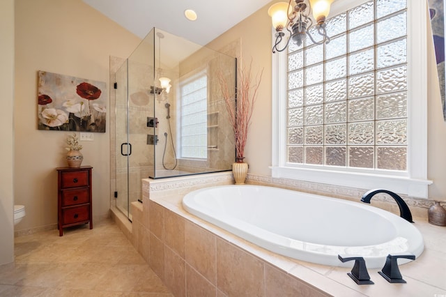 bathroom with tile patterned floors, toilet, independent shower and bath, and a notable chandelier