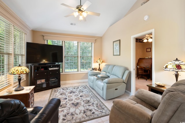 tiled living room featuring ceiling fan and lofted ceiling