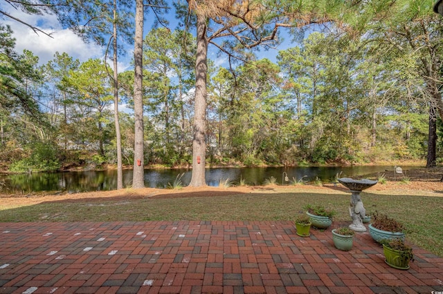 view of patio / terrace featuring a water view