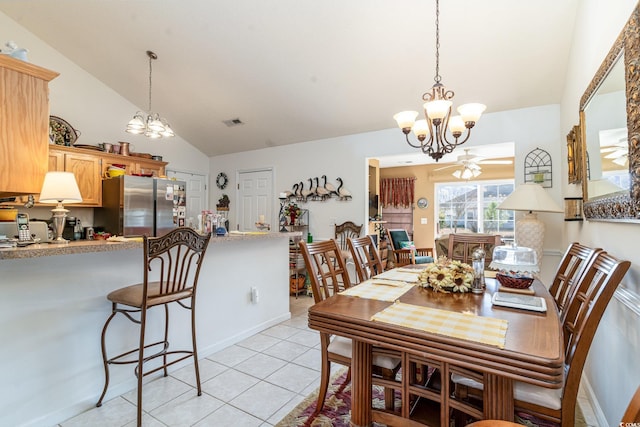 tiled dining room with ceiling fan with notable chandelier and lofted ceiling