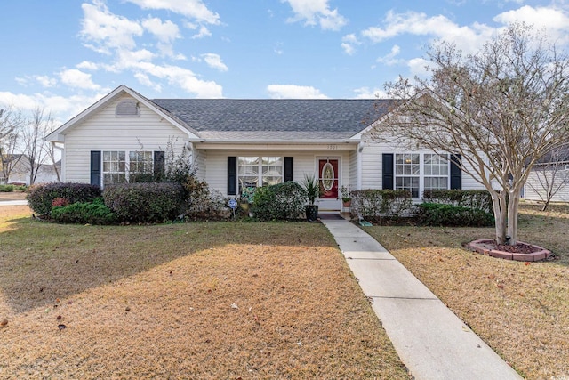 ranch-style house featuring a front lawn