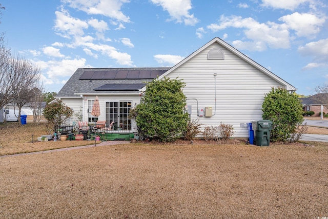 back of property with solar panels